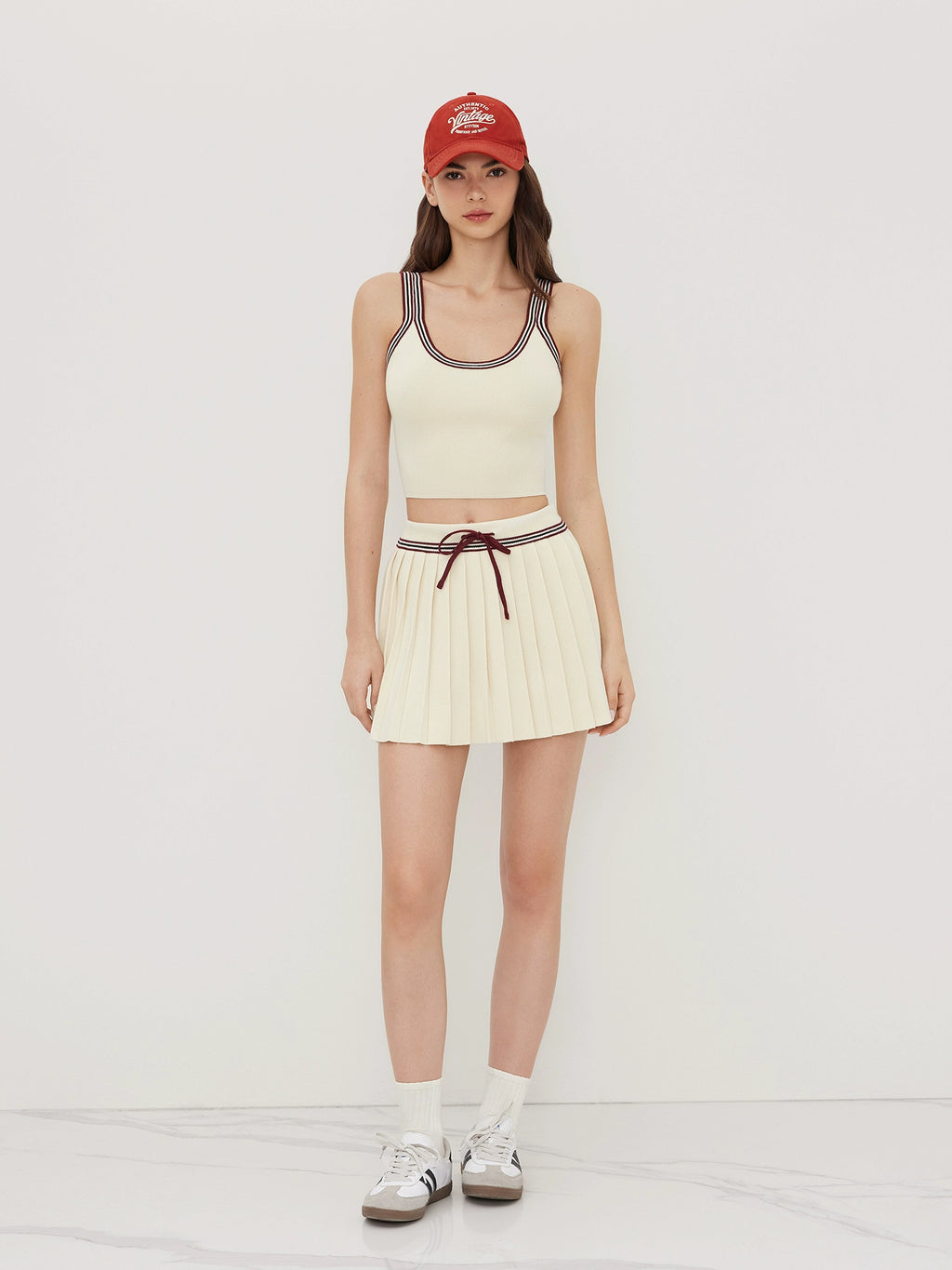 Knitted U-Neck Striped Vest with Mid-Rise Pleated Mini Skirt Set