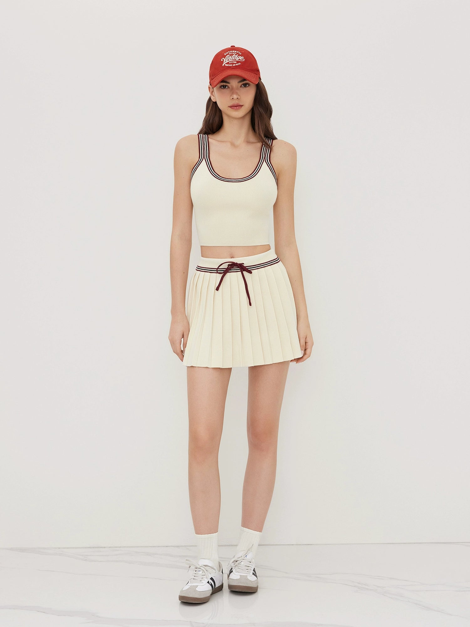 Knitted U-Neck Striped Vest with Mid-Rise Pleated Mini Skirt Set