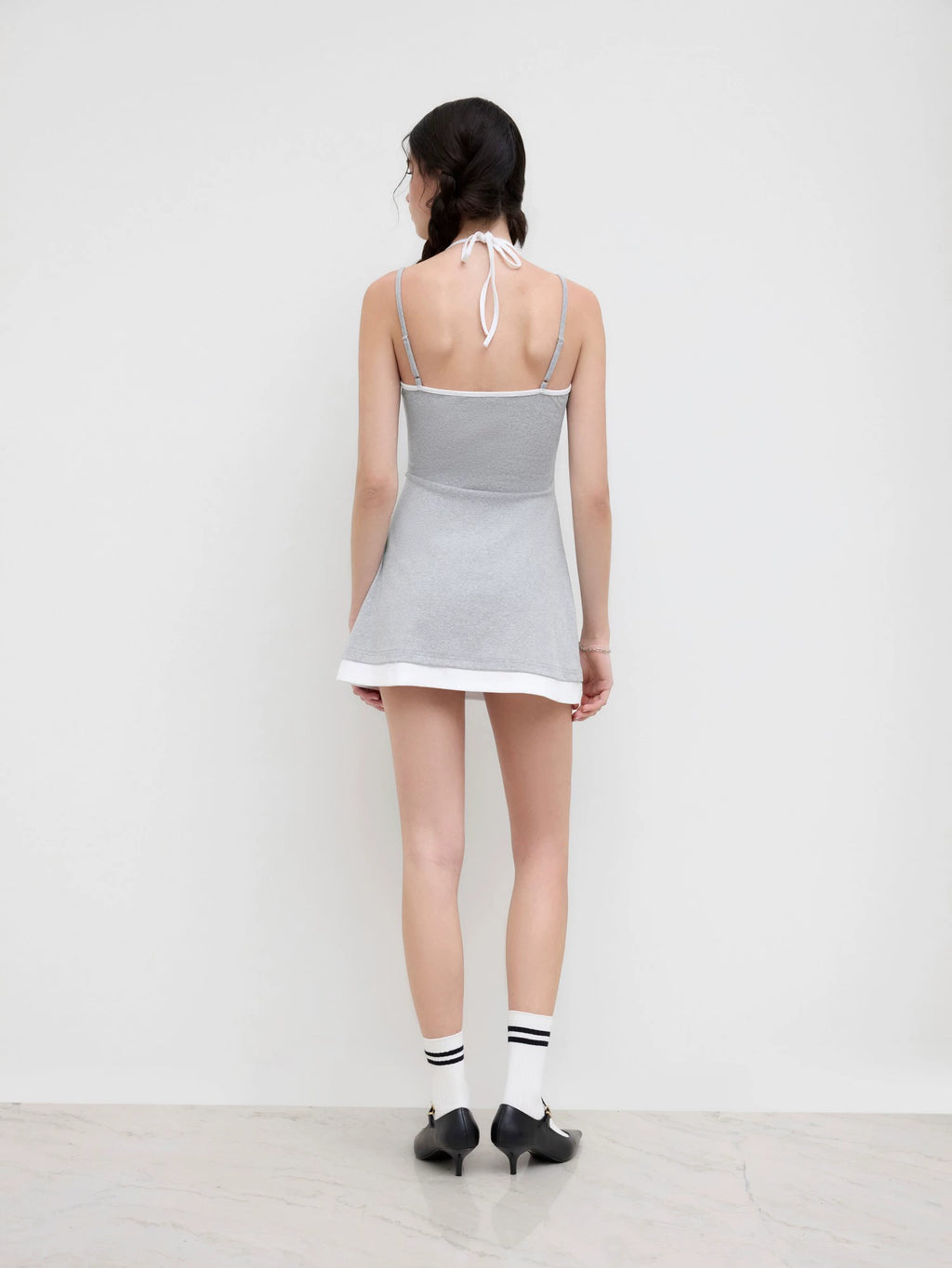 cotton-blend halterneck two-tone pleated cropped dress