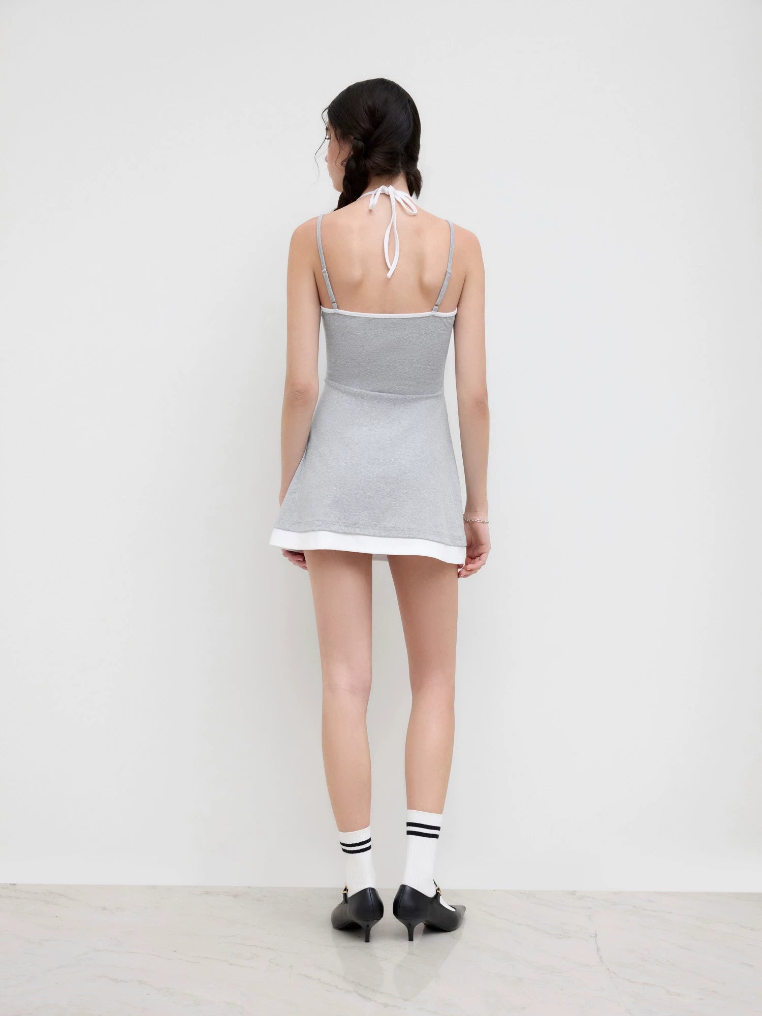 cotton-blend halterneck two-tone pleated cropped dress